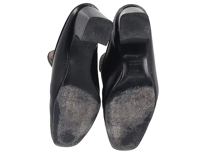 Mules Hermès Diane con hebilla Roulis en cuero de cabra negro 
